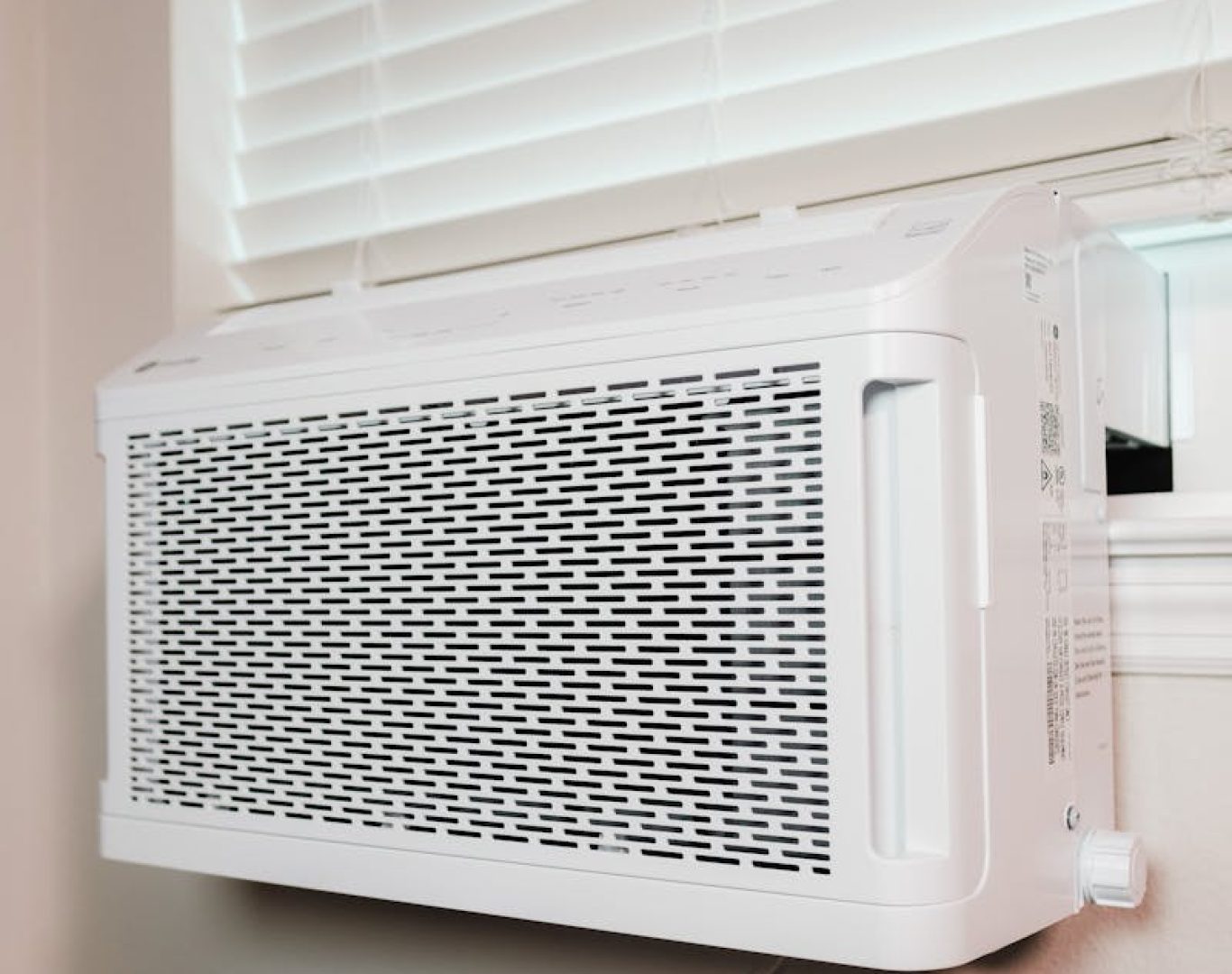 Wall-mounted air conditioner installed in a residential setting, providing cooling comfort.